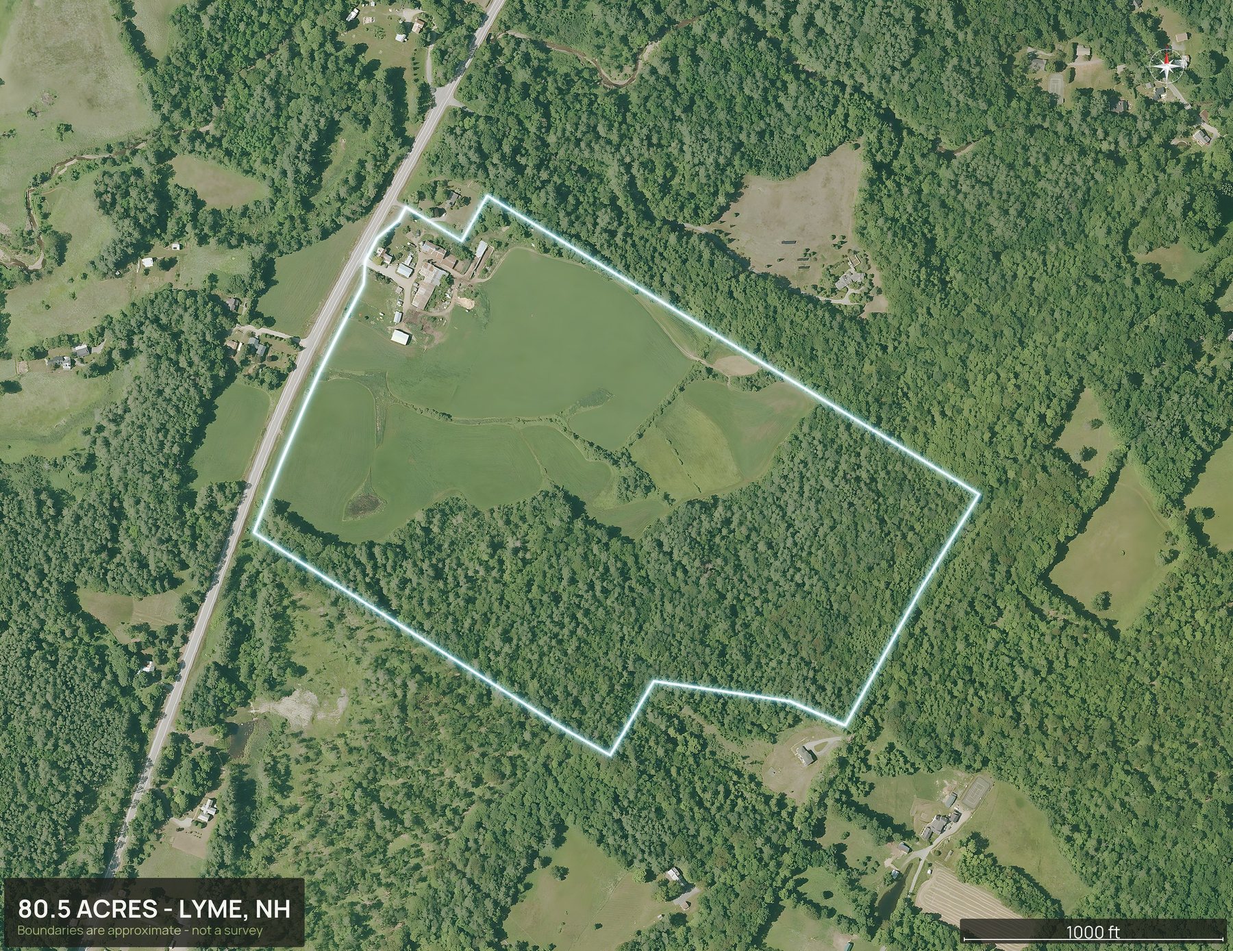 Outlined top down aerial photo of a New Hampshire land parcel with the boundary drawn in green