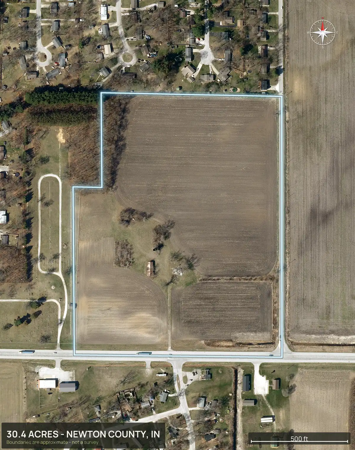 Top down aerial of a 30.4 acre farm field tract with the boundary outlined, before any lot lines, with houses to the north and a road along the south