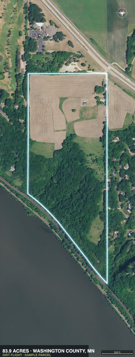 Top down aerial photo of the 83.9 acre parcel with a glowing white boundary outline